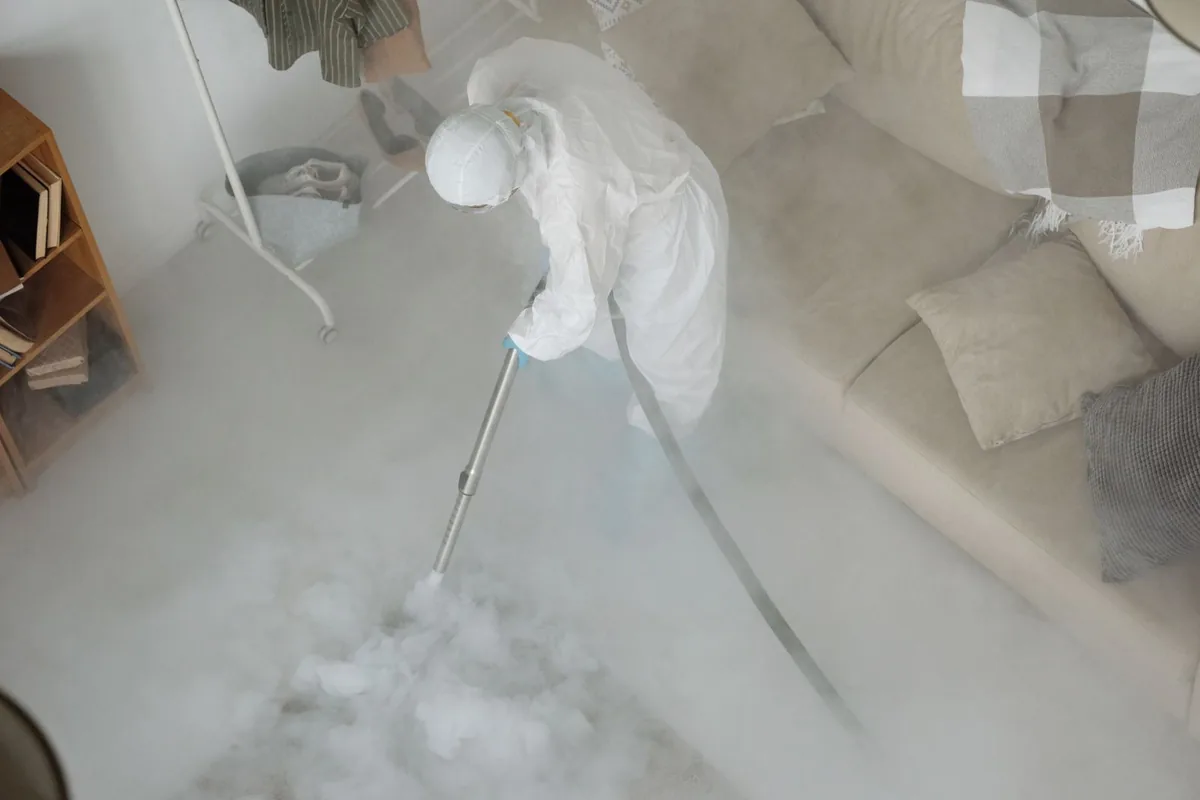Biohazard cleanup technician in protective equipment, Ettrick, VA